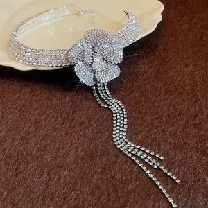 Close-up of elegant silver rhinestone flower choker necklace with long tassels