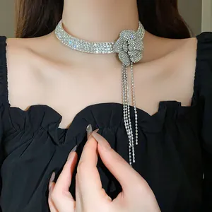 Close-up of sparkling rhinestone flower choker with long tassel detail
