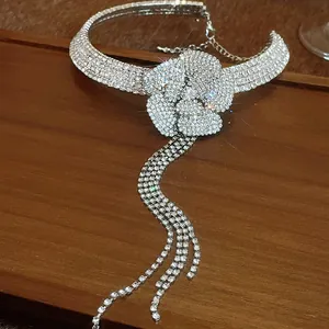 Close-up of sparkling rhinestone flower choker necklace with elegant long tassels