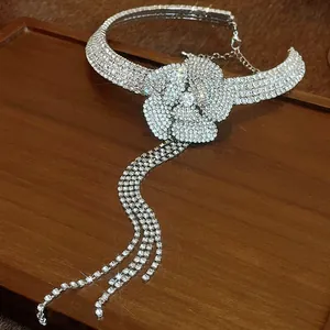 Close-up of sparkling rhinestone flower choker with elegant dangling tassels