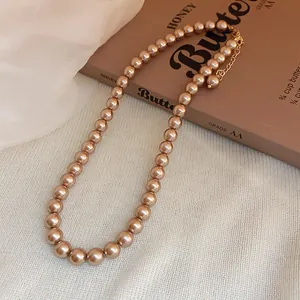 Elegant champagne-colored pearl necklace with gold-tone adjustable extender chain for women