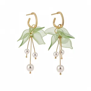 Elegant green petal tassel earrings with white pearls and gold-tone silver needles.