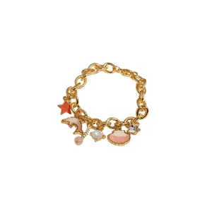 Elegant gold ocean charm bracelet featuring starfish dolphin and seashell pendants for women