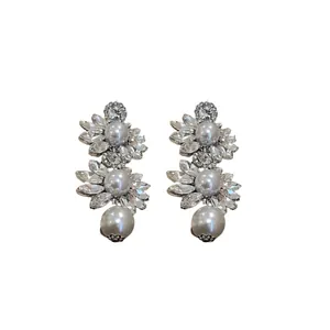 Elegant vintage floral rhinestone drop earrings with white faux pearls in silver