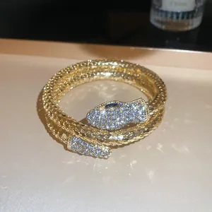Elegant gold-plated snake shaped necklace featuring pavé rhinestones and a magnetic clasp