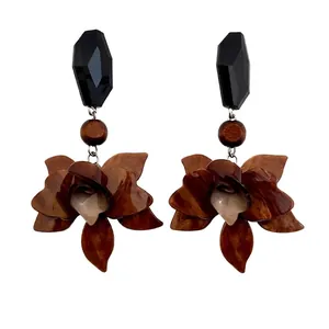 Vintage brown resin flower drop earrings with faceted black geometric stud accents.
