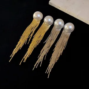 Elegant pearl long tassel dangle earrings in gold and silver metallic finish for women.