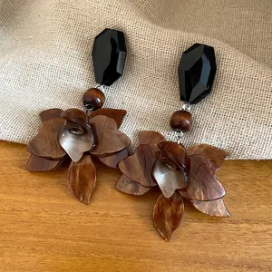 Close-up of vintage Maillard resin flower drop earrings with marble pattern
