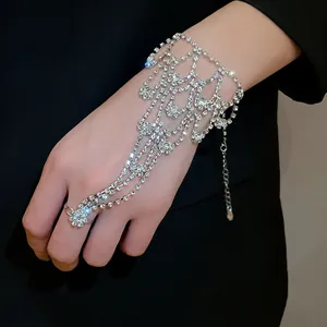Elegant rhinestone ring bracelet harness for prom, showing detailed sparkling hand jewelry