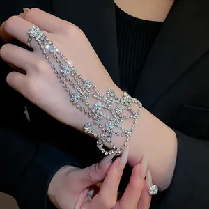 Close-up view of a sparkling rhinestone hand harness ring bracelet combo.