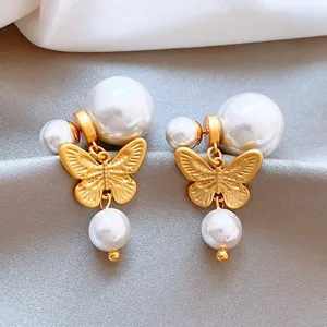 Elegantes pendientes de mariposa bañados en oro con perlas para mujer estilo retro francés.