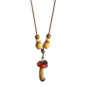 Vintage ethnic style mushroom pendant necklace with wooden beads and brown cord