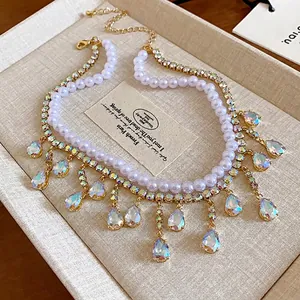 Elegant double-layered pearl necklace with shimmering zircon teardrop fringe charms