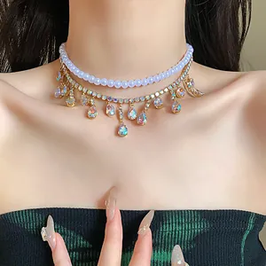 Close-up of double layer choker with white pearls and iridescent teardrop pendants