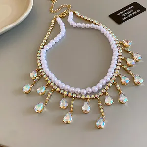 Elegant double-layer pearl necklace with shimmering zircon teardrop tassels detail