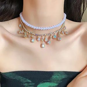Close-up of double-layer pearl and rhinestone choker with iridescent teardrop tassels