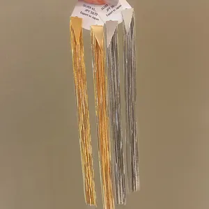 Detailed view of long gold and silver tassel earrings with S925 silver posts
