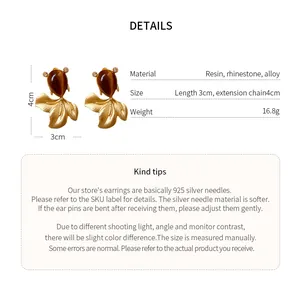 Detail card showing dimensions and materials of vintage fish rhinestone earrings