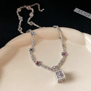 Vintage silver necklace with rhinestone square cube pendant featuring cross motif
