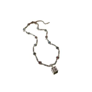 Retro silver-toned chain necklace with colorful stones and engraved square cross pendant