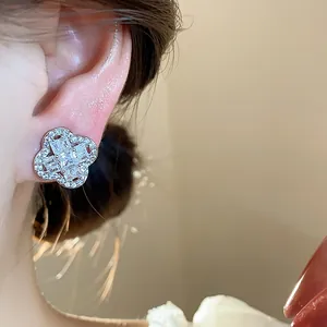 Close-up of elegant silver zircon flower ear clip showing delicate sparkling stone details