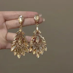 Macro view of sparkling champagne zircon flower chandelier earrings for women