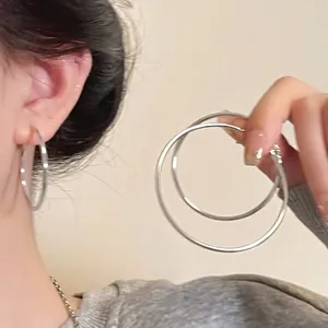 Minimalist large silver hoop earrings for women with high-quality polished metal finish