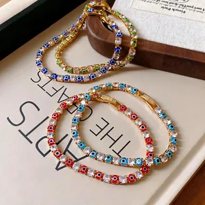 Gold-plated tennis bracelet with cubic zirconia and colored evil eye charms