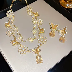 Elegant retro hollow butterfly and flower jewelry set with yellow pear-shaped stone pendants
