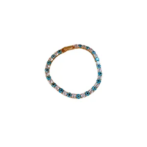 Elegant gold-plated bracelet featuring blue evil eye beads and sparkling cubic zirconia