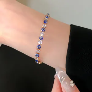 Detailed shot of a gold evil eye bracelet featuring sparkling cubic zirconia on a wrist