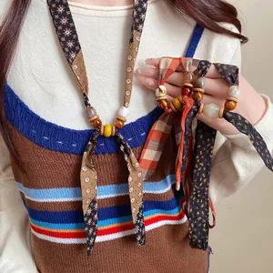 Bohemian retro chiffon fabric necklace with wooden and ceramic beads in earth tones