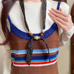Bohemian chiffon fabric necklace with vintage wood and ceramic beads on model's neck