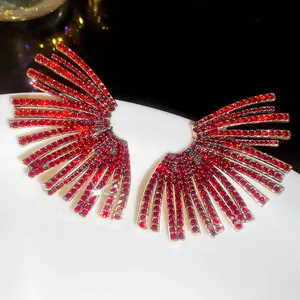 Macro view of sparkling red zircon fan-shaped earrings featuring a high-end luxury design
