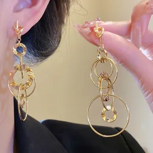 Elegant gold knotted multi-hoop earrings with textured wavy finish for high-end style.