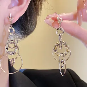 Detail view of silver knotted hammered multi-layered circle dangle earrings for women