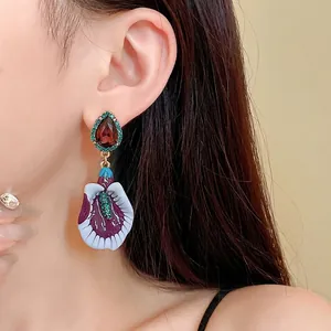 Elegant vintage lavender floral drop earrings with unique relief design and crystal accents