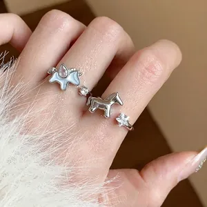 Elegant silver ring featuring horse and star charms with zircon stones for women.