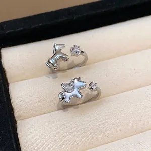 Silver-tone open rings with star and horse motifs, featuring elegant zircon accents.