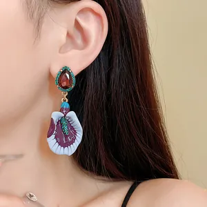 Vintage purple flower drop earring with red teardrop gem and embossed petal details