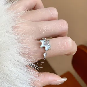 Close-up of elegant silver horse ring with sparkling zircon stone on finger, luxury style