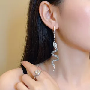 Elegant silver snake-shaped drop earrings with sparkling rhinestones for stylish women