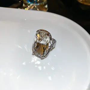 Vintage palace style ring with large cushion-cut clear gemstone and silver textured band