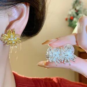 Detailed macro view of stylish firework-shaped earrings with rhinestones and pearls