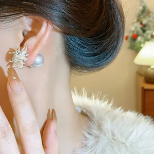 Detailed macro view of elegant firework shaped pearl stud earrings worn on an ear