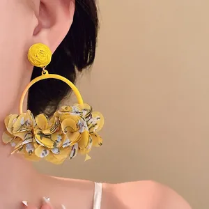 Statement yellow fabric floral petal hoop earrings with elegant woven stud detail