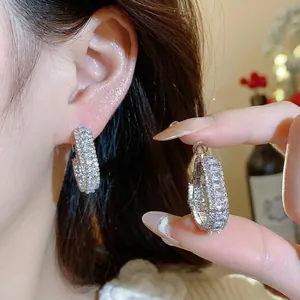 Elegant silver hoop earrings with sparkling cubic zirconia in geometric design for women