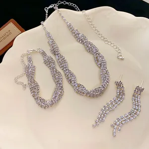 Detailed view of twisted multi-row rhinestone necklace bracelet and earrings set