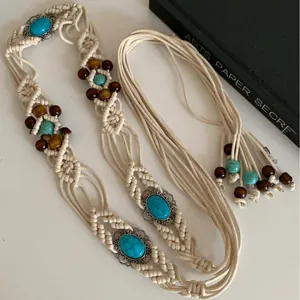 Detailed view of a boho macrame belt featuring turquoise stones and wooden beads
