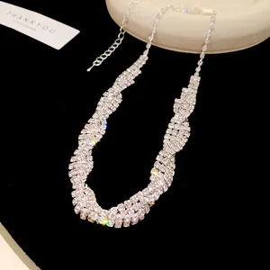 Detailed view of an elegant sparkly multi-row rhinestone necklace in silver-tone.
